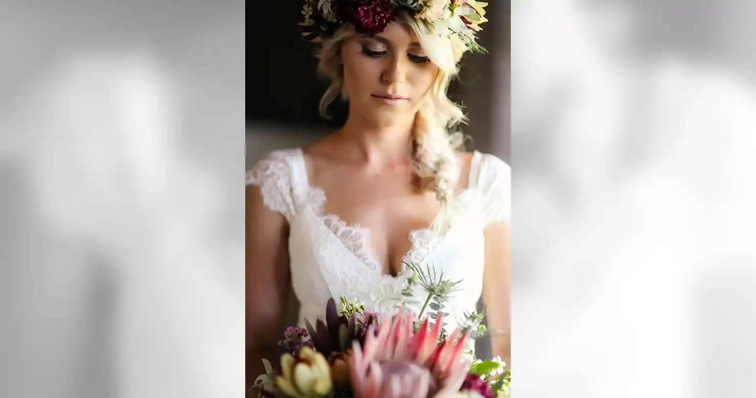 The same bridal portrait after colour correction, with warm balanced skin tones and lifted detail in the dress